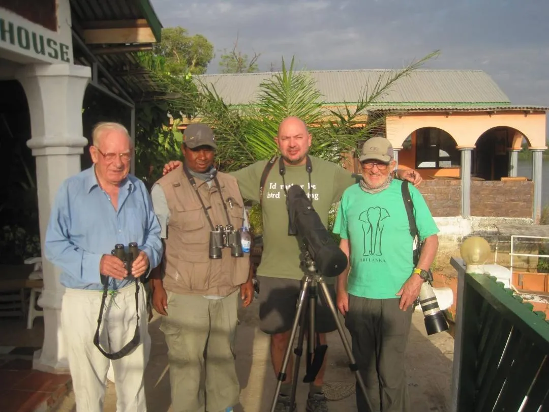 Guide and birders in front of Riverside Lodge on the River Gambia